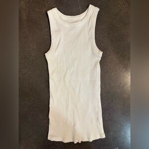 Maurice’s white tank